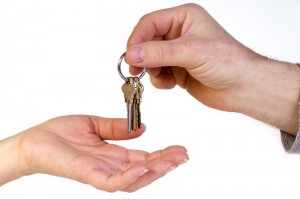Person is giving keys to someone else